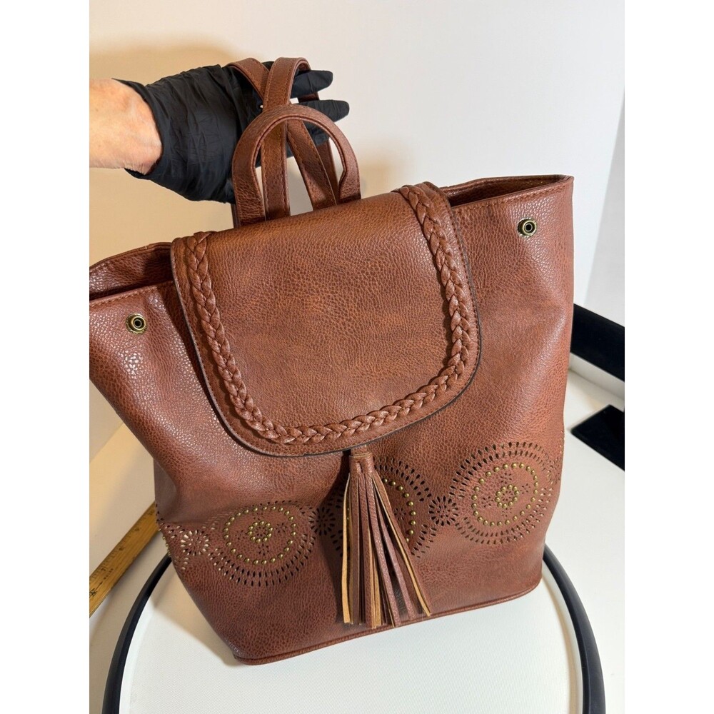 Vegan Leather Brown Backpack Purse With Boho Perforated Design Tassel Accent Adj